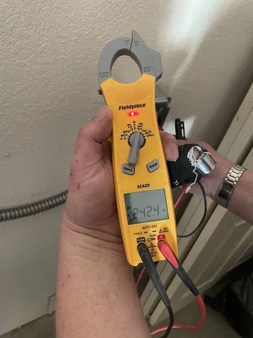 Voltage testing with clamp meter during Whole House Surge Protector in Des Moines